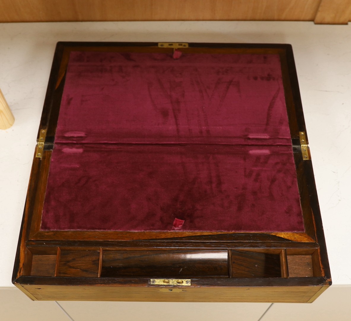 A Regency brass inlaid rosewood writing slope, 51 cms wide x 17 cms high.